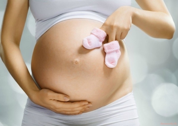 Почему болят яичники при беременности